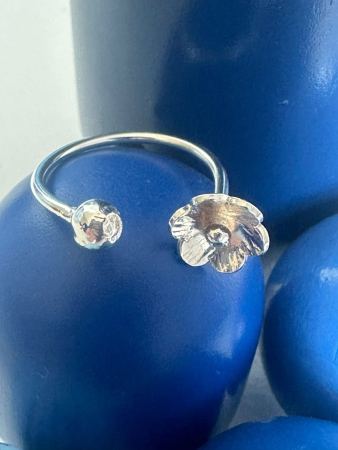 Flower and solid silver ball adjustable ring
